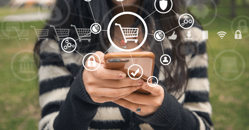 person holding cell phone with shopping icons overlayed